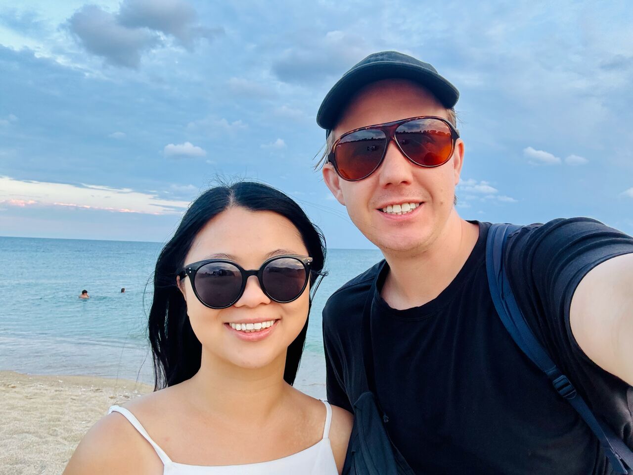 Two startup founders from Receipt-AI.com (Ian and Queenie) taking a selfie by the water, capturing a quiet moment during the journey of building Receipt AI from $0 to $40M in receipts. 
