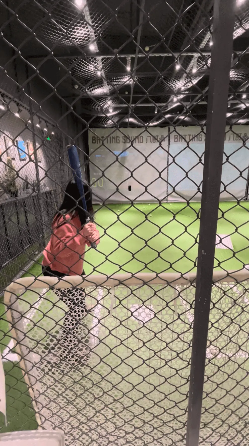 Founder of Receipt-AI.com practicing their swing in an indoor batting cage, a visual metaphor for the article’s theme of showing up, taking extra reps, and building momentum through small consistent effort.
