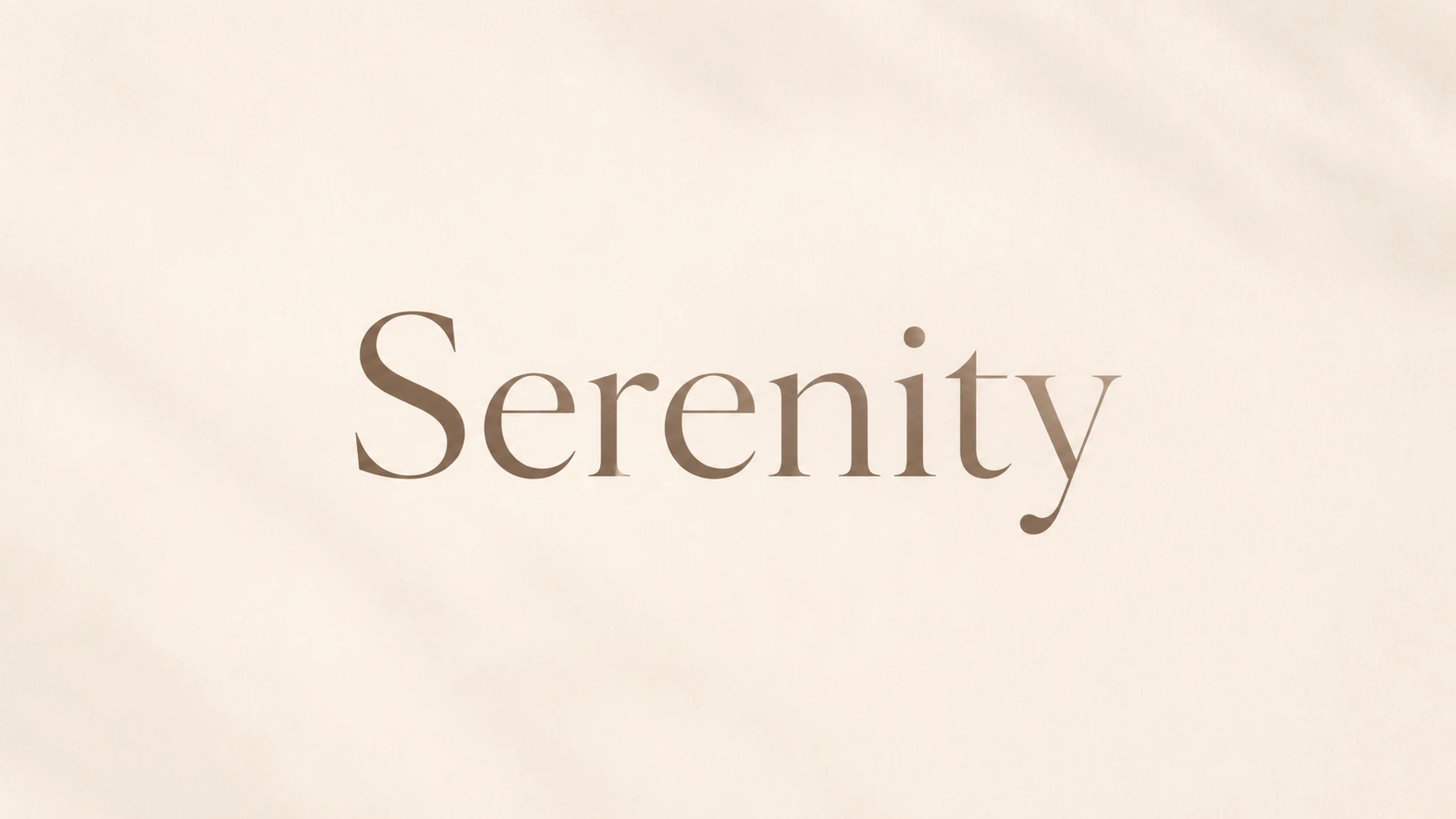 Minimal editorial image with the word Serenity centered on a soft warm background.