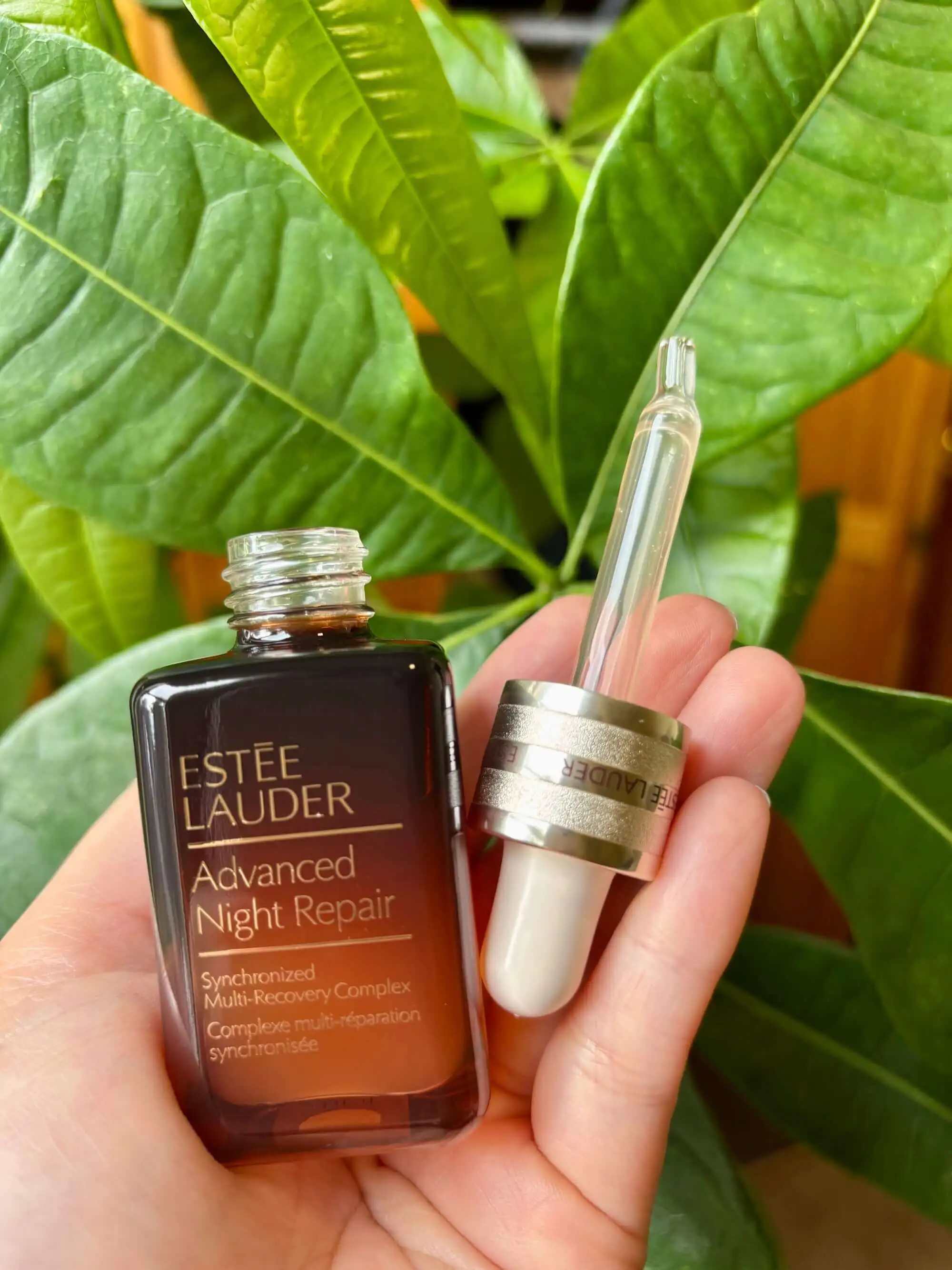 Receipt-Ai.com: Close-up of an Estée Lauder Advanced Night Repair serum bottle and its larger dropper, illustrating the story about subtle product design changes that make consumers use more, faster.