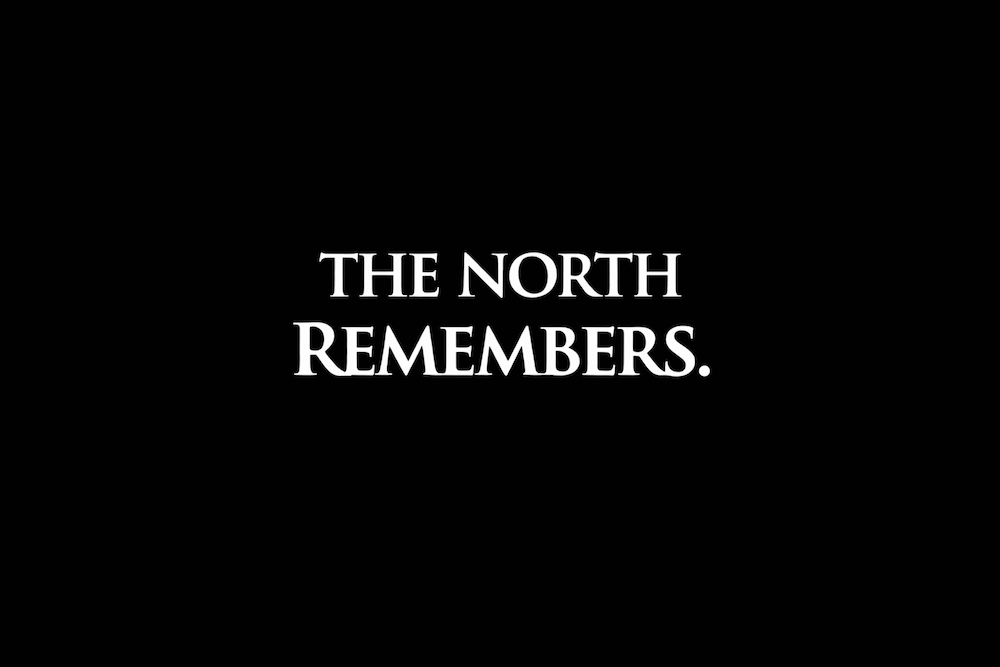 Black background with centered white text reading “THE NORTH REMEMBERS.”